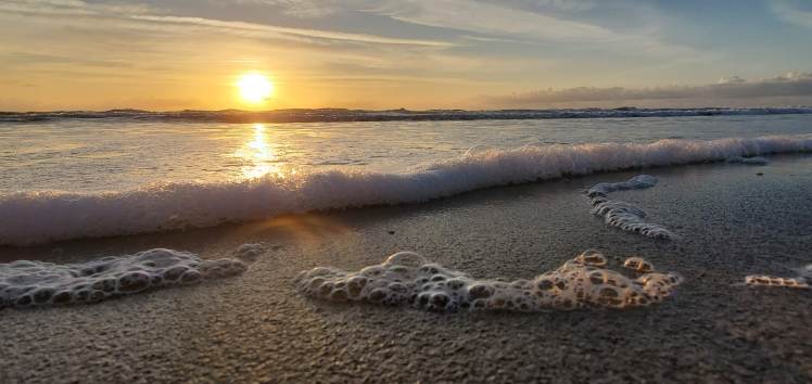 Sea foam and sunrise from Cocoa Beach