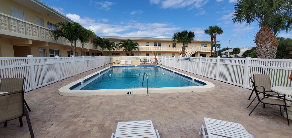 Pool view of the Morgan Manor condos in Cape Canaveral