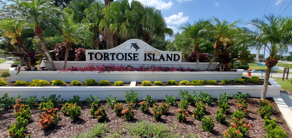 The entry to Tortoise Island in Satellite Beach. This development offers 24 hour guarded entry to the community and home options on the Banana River and on the Grand Canal.