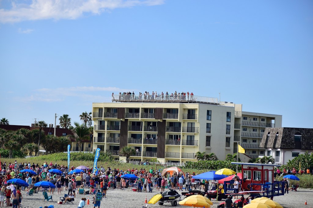 Crowded beach at the Cocoa Beach Pier