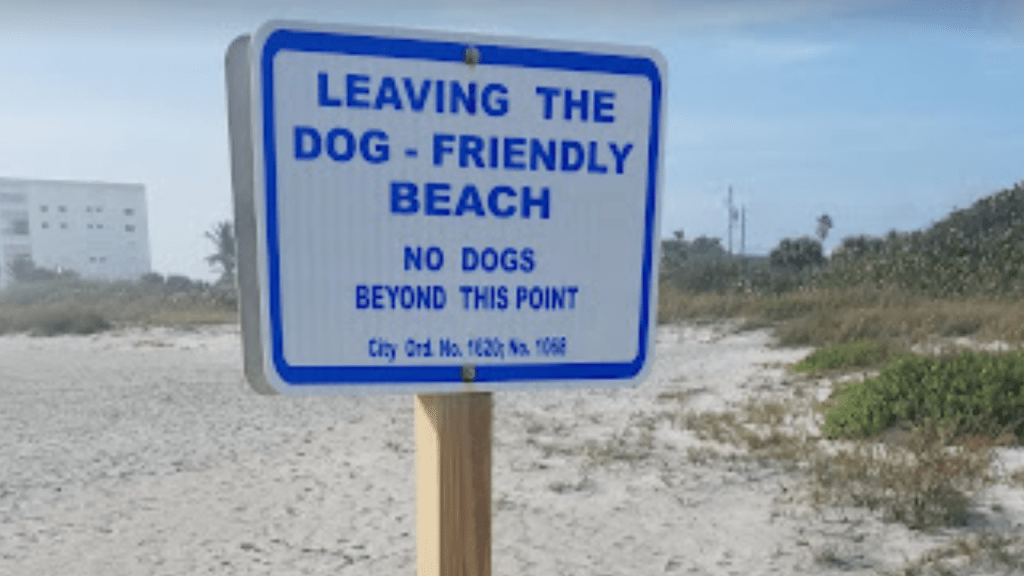 signs in Cocoa Beach showing you are leaving the dog beach area