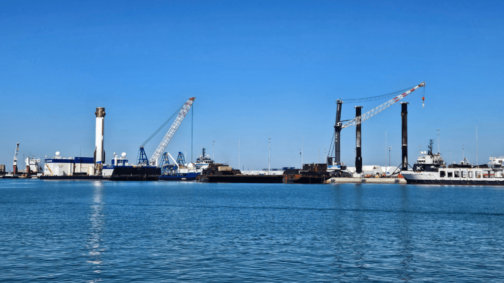 Boosters that have returned from space at the Port. New Glenn is on the left and 2 SpaceX boosters on the right