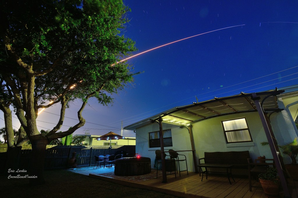 Photo from the backyard in Cocoa Beach of a night launch