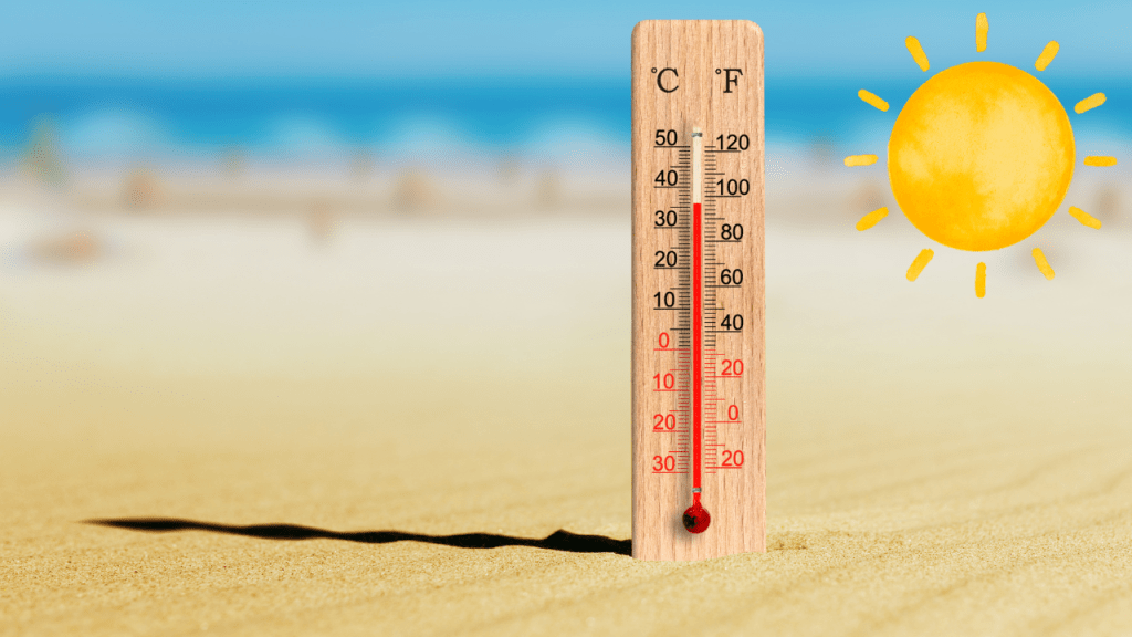 thermometer on the beach showing how hot it gets
