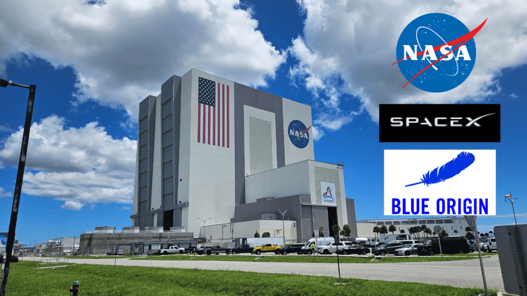 The Vehicle assembly building with graphics for NASA, Blue Origin, and SpaceX